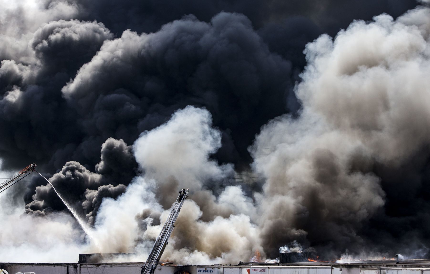 Large fire rolls through warehouse